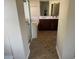Bathroom with vanity, soaking tub, and glass-enclosed shower; features updated fixtures and tile flooring at 4523 E Gleneagle Dr, Chandler, AZ 85249