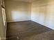 Bright living room featuring wood-look flooring and neutral paint, ready for personalization at 4523 E Gleneagle Dr, Chandler, AZ 85249