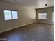 Bright living room with tile flooring, multiple windows, and neutral walls create an inviting atmosphere at 4523 E Gleneagle Dr, Chandler, AZ 85249