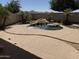 Backyard pool with rock waterfall feature, set against a desert landscape at 4523 E Gleneagle Dr, Chandler, AZ 85249