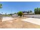 Backyard featuring a shed, concrete patios, and view of the surrounding neighborhood at 527 N Pasadena --, Mesa, AZ 85201
