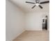 A bright bedroom features a ceiling fan, and a view of the bathroom vanity and mirror at 527 N Pasadena --, Mesa, AZ 85201