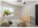 Staged bedroom with natural light, artwork and neutral color palette at 527 N Pasadena --, Mesa, AZ 85201