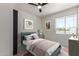 Staged bedroom featuring a cozy bed, natural light, and modern decor at 527 N Pasadena --, Mesa, AZ 85201