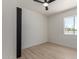 Bright room with wood-look flooring, closet, and a window with views of the outside at 527 N Pasadena --, Mesa, AZ 85201