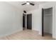 Bedroom with bright walls, a ceiling fan, and a closet with sliding doors at 527 N Pasadena --, Mesa, AZ 85201