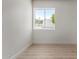Bright bedroom features a window view of trees and exterior building at 527 N Pasadena --, Mesa, AZ 85201