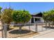Charming home with a fenced yard and mature trees providing shade at 527 N Pasadena --, Mesa, AZ 85201