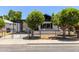 Charming single story home with covered parking, white exterior and low brick wall surrounding the property at 527 N Pasadena --, Mesa, AZ 85201