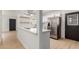 Modern kitchen with white countertops, stainless steel appliances, and open shelving at 527 N Pasadena --, Mesa, AZ 85201