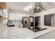 Modern kitchen features white cabinets, marble counters, and stainless steel appliances at 527 N Pasadena --, Mesa, AZ 85201