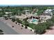 Luxury home featuring a sparkling pool, lush landscaping with palm trees, and mountain views at 6305 E Arabian Way, Paradise Valley, AZ 85253