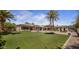 Lush backyard featuring meticulously maintained grounds, palm trees, and luxurious pool area offering unparalleled outdoor living at 6305 E Arabian Way, Paradise Valley, AZ 85253