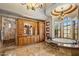 A bathroom with a soaking tub, a vanity with storage, and decorative lighting at 6305 E Arabian Way, Paradise Valley, AZ 85253