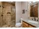 This beautiful bathroom features tile walls, a walk-in shower, and granite countertops at 6305 E Arabian Way, Paradise Valley, AZ 85253
