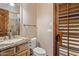 Bathroom featuring a wooden door with shuttered windows providing natural light at 6305 E Arabian Way, Paradise Valley, AZ 85253