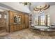 Lavish bathroom with marble tile, dual vanities, a soaking tub, and a separate shower, creating a spa-like retreat at 6305 E Arabian Way, Paradise Valley, AZ 85253