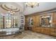 Luxurious bathroom with marble tile, dual vanities, and a soaking tub, creating a spa-like retreat at 6305 E Arabian Way, Paradise Valley, AZ 85253