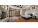 A bedroom with hardwood floors, a fireplace, a decorative ceiling, and large windows at 6305 E Arabian Way, Paradise Valley, AZ 85253