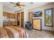 Comfortable bedroom featuring a ceiling fan, natural light, cabinets and a wet bar at 6305 E Arabian Way, Paradise Valley, AZ 85253