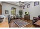 Relaxing den with hardwood floors, shuttered windows, and comfortable seating at 6305 E Arabian Way, Paradise Valley, AZ 85253