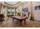 Spacious game room with pool table and fireplace, perfect for entertainment and leisure at 6305 E Arabian Way, Paradise Valley, AZ 85253