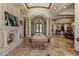 Entertain in the game room, which includes a pool table and fireplace, ideal for relaxation at 6305 E Arabian Way, Paradise Valley, AZ 85253