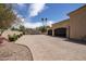 Spacious motor court leads to a two-car garage with attractive doors at 6305 E Arabian Way, Paradise Valley, AZ 85253
