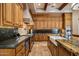 Gourmet kitchen features custom wood cabinets, granite countertops, and stainless steel appliances at 6305 E Arabian Way, Paradise Valley, AZ 85253