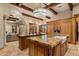 Gourmet kitchen features custom wood cabinets, granite countertops, island, and stainless steel appliances at 6305 E Arabian Way, Paradise Valley, AZ 85253
