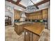 Spacious kitchen with wooden beams, granite countertops, custom cabinets, stainless steel appliances and designer lighting at 6305 E Arabian Way, Paradise Valley, AZ 85253