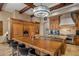 Gourmet kitchen features custom wood cabinets, granite countertops, island, and stainless steel appliances at 6305 E Arabian Way, Paradise Valley, AZ 85253