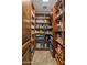 Walk-in pantry with custom built-in shelves for organized storage at 6305 E Arabian Way, Paradise Valley, AZ 85253