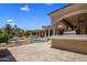 Backyard view showcasing a pool, outdoor kitchen, covered patio, and lush landscaping at 6305 E Arabian Way, Paradise Valley, AZ 85253