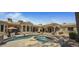 Lush backyard with a large pool, spa, and tanning deck, offering a perfect blend of luxury and tranquility at 6305 E Arabian Way, Paradise Valley, AZ 85253
