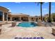 Backyard pool with fountains, surrounded by manicured landscaping and a covered patio at 6305 E Arabian Way, Paradise Valley, AZ 85253