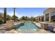 Beautiful backyard showcasing a pristine pool, fountains, meticulously manicured landscaping, and resort-style amenities at 6305 E Arabian Way, Paradise Valley, AZ 85253