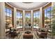 Bay window sitting area featuring a view of the outdoor pool area and beautifully landscaped grounds at 6305 E Arabian Way, Paradise Valley, AZ 85253