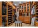 A walk-in closet with custom storage solutions for shoes, clothing, and accessories at 6305 E Arabian Way, Paradise Valley, AZ 85253