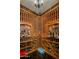 Well-stocked wine cellar features custom wooden racks to organize wine collection at 6305 E Arabian Way, Paradise Valley, AZ 85253