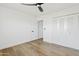 Clean bedroom featuring a ceiling fan and closet with folding doors at 6420 S Wilson St, Tempe, AZ 85283