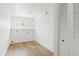 Bright and spacious laundry room with built-in shelving and a window at 6420 S Wilson St, Tempe, AZ 85283
