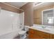 Bathroom with combined shower and tub and wooden vanity at 6758 W Quail Ave, Glendale, AZ 85308