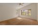 Bright and airy bedroom with neutral carpet and multiple windows offering natural light and backyard views at 6758 W Quail Ave, Glendale, AZ 85308
