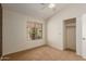 Bright bedroom features carpet floors, a ceiling fan, a closet and a large window at 6758 W Quail Ave, Glendale, AZ 85308