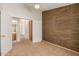 Bedroom with an en-suite bathroom access and a accent wall at 6758 W Quail Ave, Glendale, AZ 85308