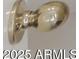 Close-up of the gold finish of a door knob at 6758 W Quail Ave, Glendale, AZ 85308