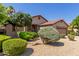 Charming single-story home featuring a well-maintained landscape, mature trees, and a two-car garage at 6758 W Quail Ave, Glendale, AZ 85308