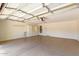 Spacious garage features built-in shelving and storage cabinets at 6758 W Quail Ave, Glendale, AZ 85308