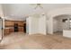 Inviting living room featuring an open floor plan, neutral paint, and an adjacent kitchen space at 6758 W Quail Ave, Glendale, AZ 85308